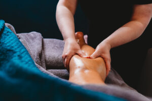 A woman getting a leg massage